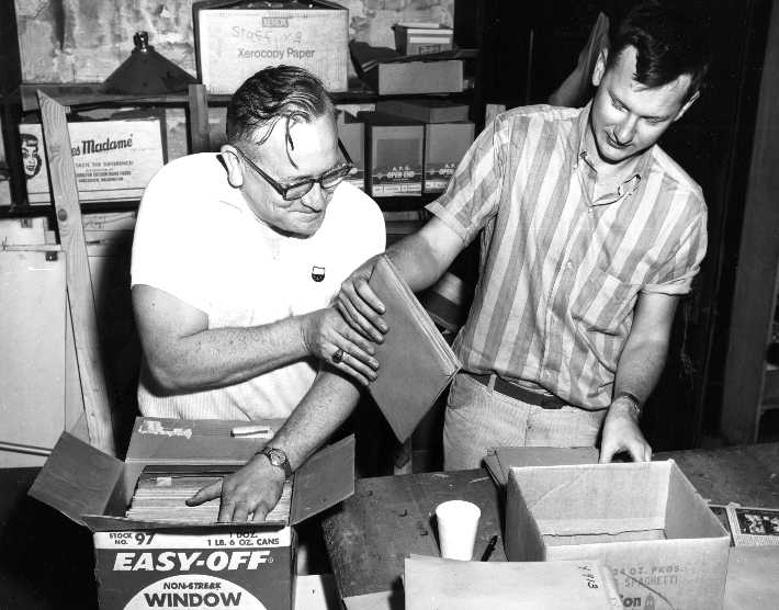 Photo: Librarians packing glass negatives. 1965