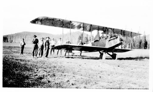 Image: Clyde Pangborn and Nick Mamer, pilots, in Hispano Standard airplane at Hog Meadows near
 Bovill preparing for fire spotting on CTPA lands. 1923. A.B. Curtis Collection. 13-01989.