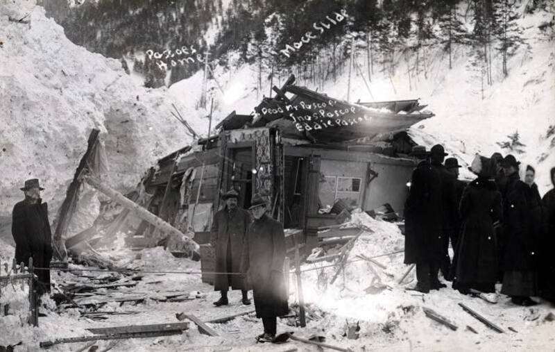 Group viewing Pascoe home demolished by snowslide. Mace, Idaho.