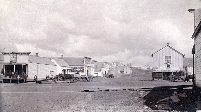 Visible: W.W. Langdon Stage Office, Farm Machinery, Saloon.