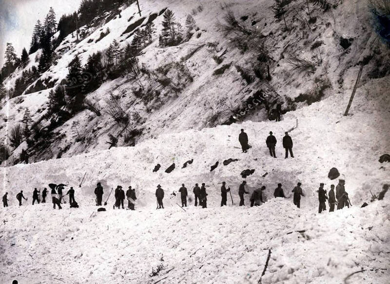Men digging out after the snowslide. Mace, Idaho.