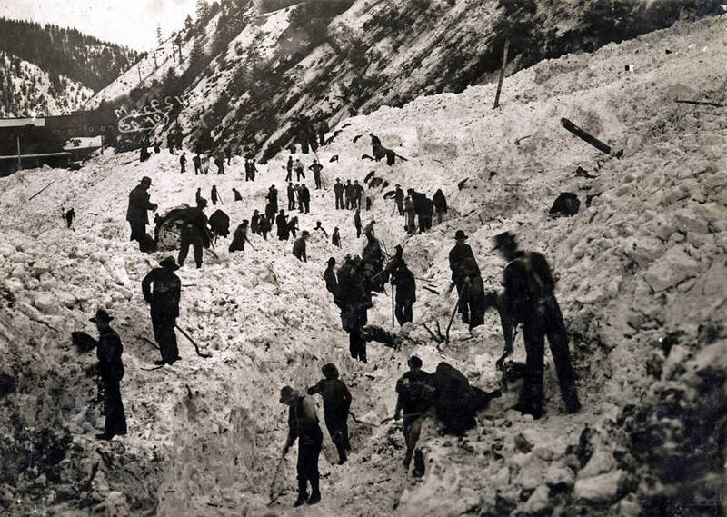 Men digging out after the snowslide. Mace, Idaho.