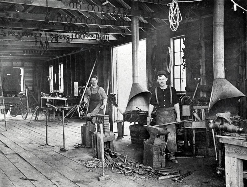 Men working in shop: S.J. Doggett and john Collins?