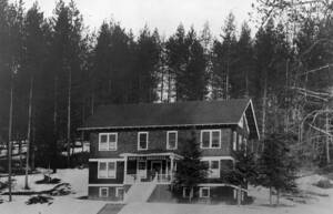 Bovill Hospital surrounded by trees and snow.