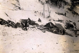 Men trying to salvage belongings from homes demolished by snowslide. Mace, Idaho.