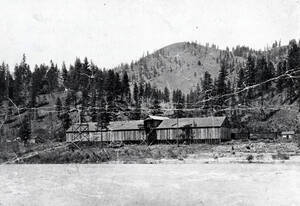 View of Clearwater River, railroad and station looking to the north. Tramway, Idaho.