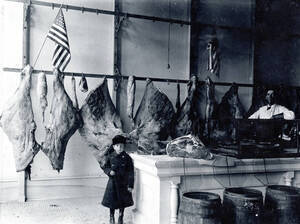 Interior of butcher shop showing Alfred and Art Flint. Range Market. Troy, Idaho.