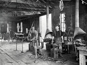 Men working in shop: S.J. Doggett and john Collins?