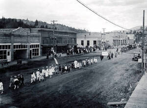 Groups of people walking down Main Street