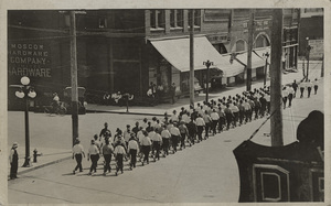 Postcard of World War 1 new recruits marching down the street in Moscow, Idaho.