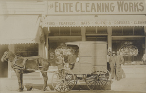 Postcard of men posing in front of a shop likely in Lewiston, Idaho.