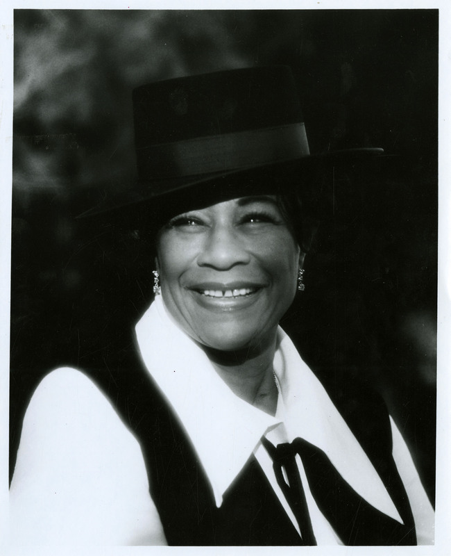 item thumbnail for Ella Fitzgerald wearing a black hat and vest