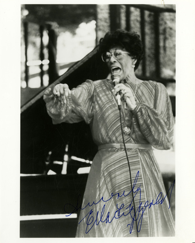 item thumbnail for Signed photograph of Ella Fitzgerald performing in a striped dress