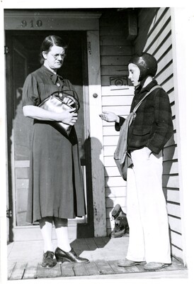 Paper boy collecting for Daily Idahonian