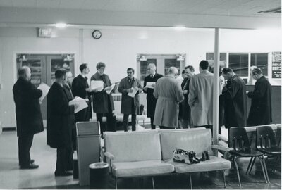 Moscow airport interior with men listening to Boyd Martin