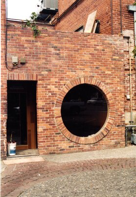 Kenworthy round window in alley