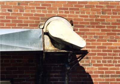 Unidentified mechanism on building in alley