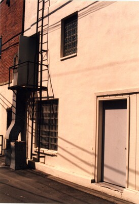 Fire escape and glass block windows in alley