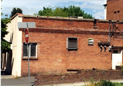 Brick building on alley at Main and Washington Streets