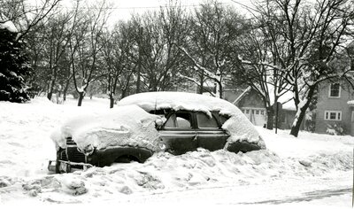 Car Blanketed in Snow