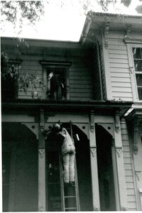 Worker Painting the Front Porch of the McConnell Mansion