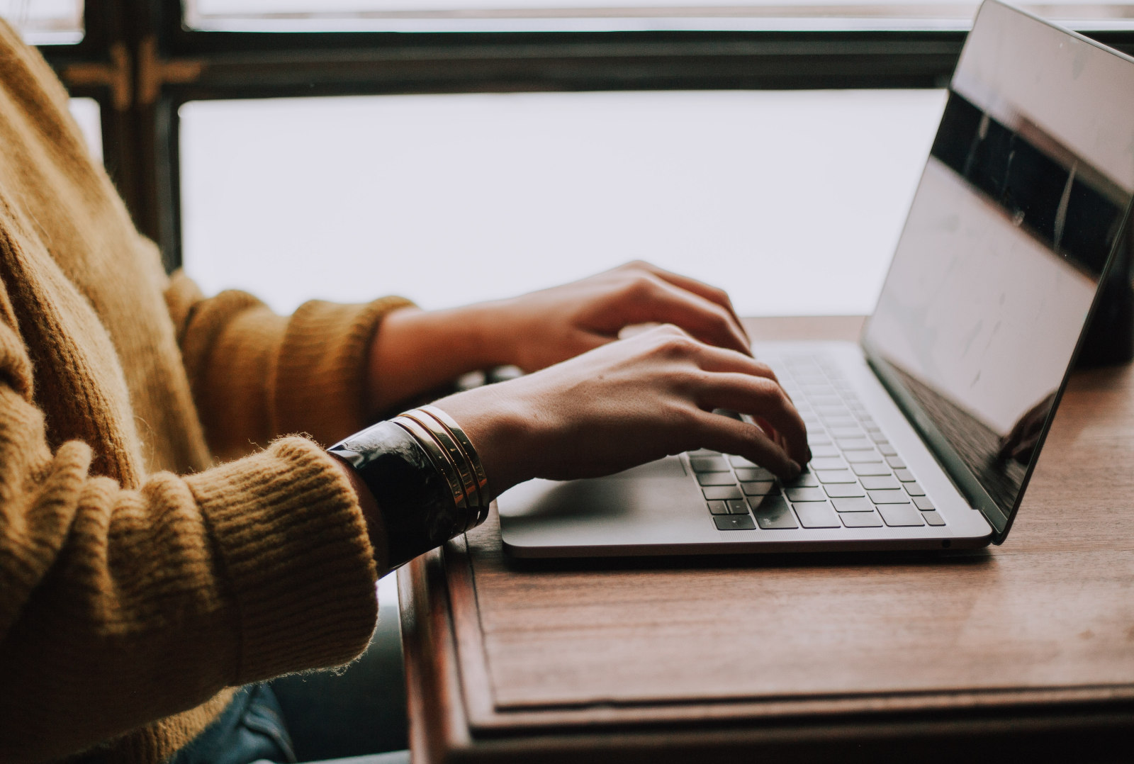 laptop with person typing