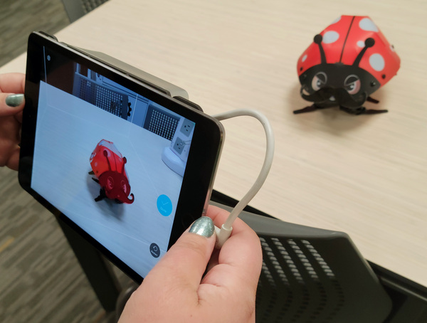 ipad device capturing a 3d image of a robot insect